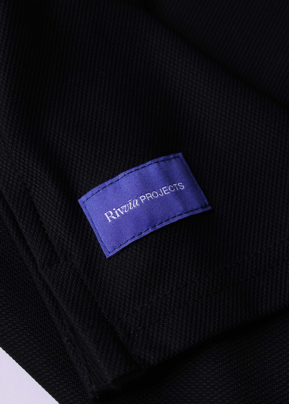 Rivvia Projects Passage Polo in BLACK CHARCOAL